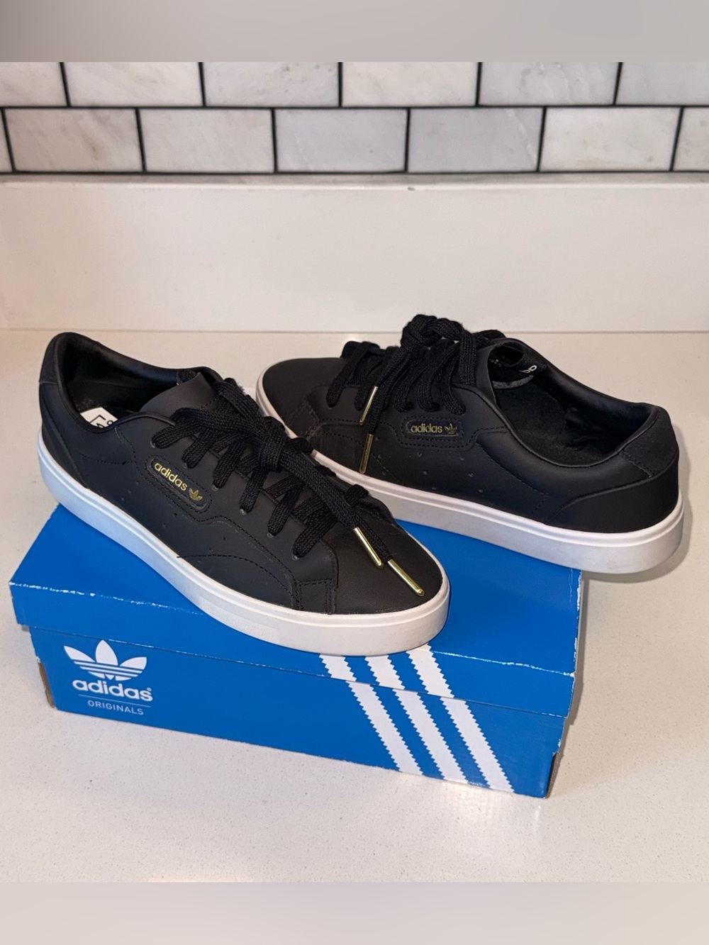 adidas Black Sneakers with White Soles and Gold Details